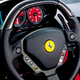The steering wheel and dashboard of a Ferrari Enzo.